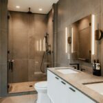 Bright renovated bathroom with tiled shower and contemporary fixtures