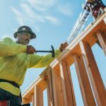 Construction professional working on timber framing