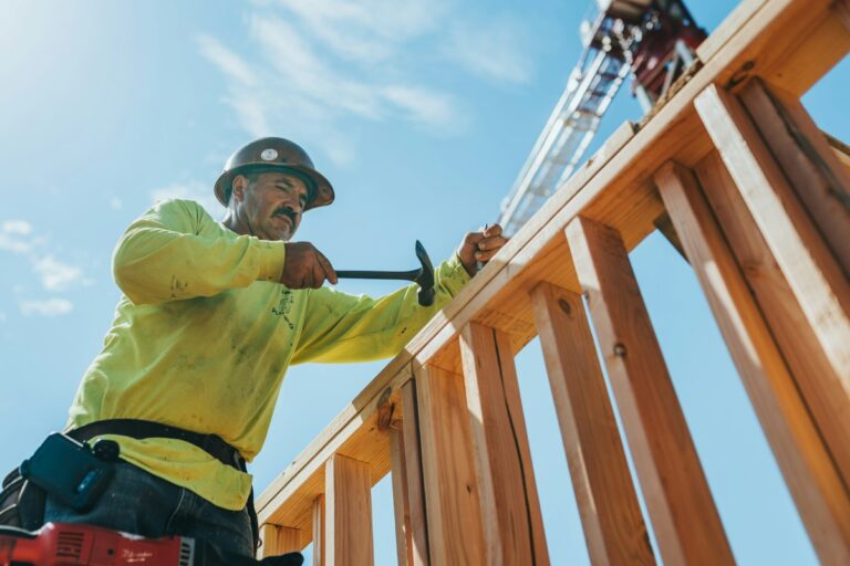 Construction professional working on timber framing